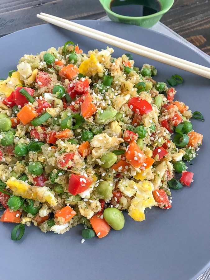 Easy Cauliflower Broccoli Egg Fried Rice - a restaurant-style inspired recipe, but on the healthy side! Made with cauliflower and broccoli in replacement of rice. Only 233 calories per serving! Very easy to make, minimal ingredients, and can be on your table in 15-minutes. Fulfill that comfort food lover in you, but without the guilt! #healthy #cauliflower #cauliflowerrice #friedrice #chinese #chinesefood | www.withpeanutbutterontop.com
