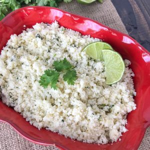 Garlic and Lime Cauliflower Rice - a delicious low-carb alternative to regular rice. This is a simple and easy-to-make side dish that uses fresh, healthy ingredients. I promise that you won't miss the rice too much! It is also great if you're looking for a comforting carb-filled meal, but without the hefty carb load! #cauliflower #cauliflowerrice #vegetables #sidedish #mexican #healthy | www.withpeanutbutterontop.com