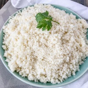 How To Make and Freeze Cauliflower Rice - this is the perfect healthy, low-carb alternative to rice, quinoa, or pasta. Being that it contains only one ingredient, it is perfect for almost any meal plan and is also easier to make than you think! All you need is a knife with a cutting board and a food processor. #healthy #sidedish #cauliflower #cauliflowerrice #diy #doityourself | www.withpeanutbutterontop.com