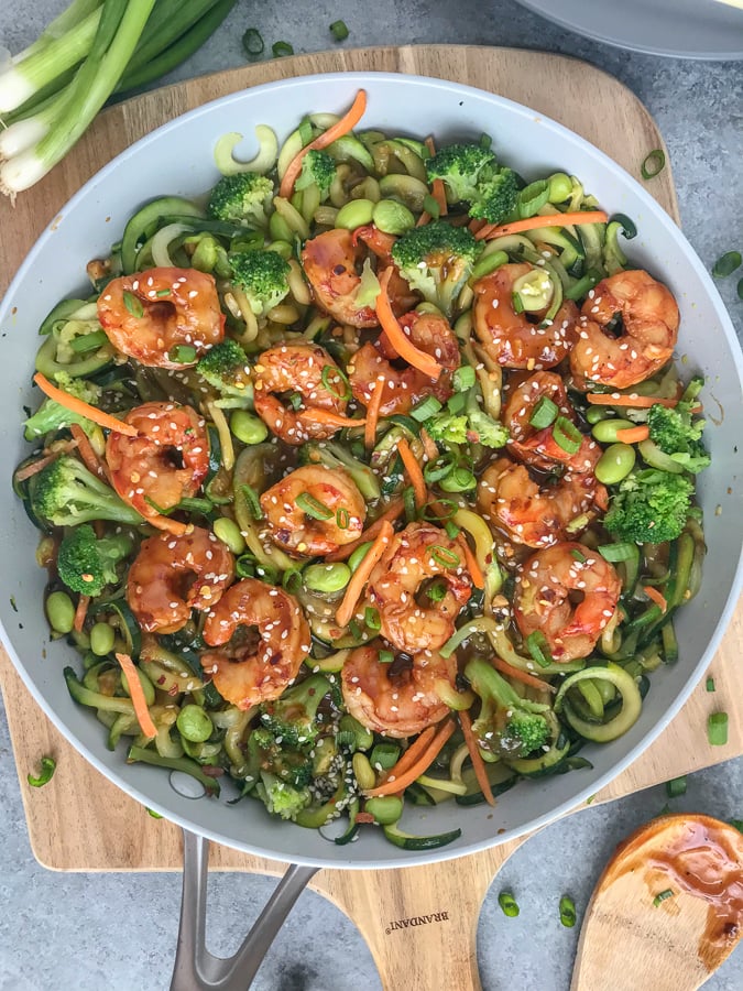 Simple Teriyaki Shrimp over Zucchini Noodles - this recipe is made with a homemade teriyaki sauce and served over zucchini noodles. Making for an easy, healthy and extremely delicious dinner option that can be on your table in 30 minutes! #shrimp #teriyaki #easy #healthy #shrimpteriyaki #zoodles #zucchininoodles | www.withpeanutbutterontop.com