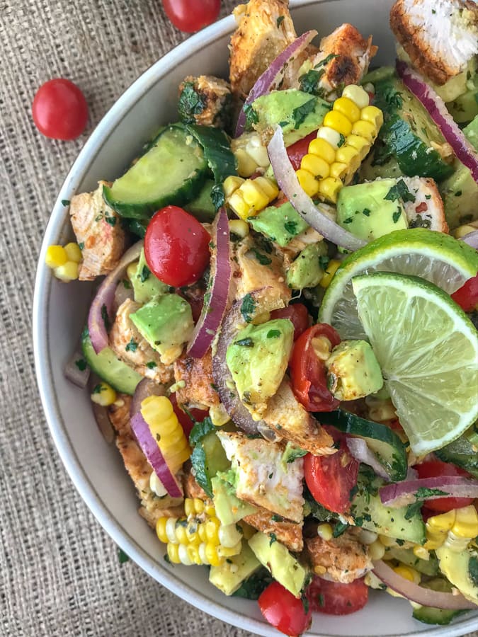 Cajun Lime Chicken Avocado Corn Salad - this salad has so much flavor! Creamy, light, and drizzled with a Cilantro Lime Dressing. It is quick and easy to make and perfect for your next barbecue or get together. Light on the calories, coming in at only 203 calories per 1 cup serving. The best part? It's just as delicious the next day, making this a good meal for your to-go lunches. #avocado #salad #chickensalad #healthy | https://withpeanutbutterontop.com
