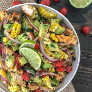 Cajun Lime Chicken Avocado Corn Salad  - this salad has so much flavor! Creamy, light, and drizzled with a Cilantro Lime Dressing. It is quick and easy to make and perfect for your next barbecue or get together. Light on the calories, coming in at only 203 calories per 1 cup serving. The best part? It's just as delicious the next day, making this a good meal for your to-go lunches. #avocado #salad #chickensalad #healthy | https://withpeanutbutterontop.com