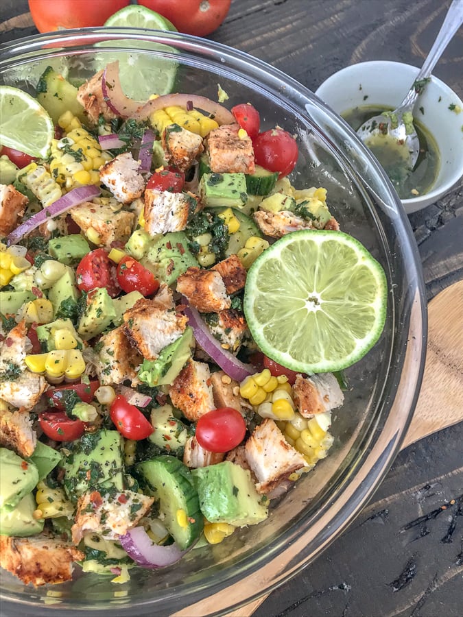 Cajun LimeÂ Chicken Avocado Corn SaladÂ  - this salad has so much flavor! Creamy, light, and drizzled with a Cilantro Lime Dressing. It is quick and easy to make and perfect for your next barbecue or get together. Light on the calories, coming in at only 203 calories per 1 cup serving. The best part? It's just as delicious the next day, making this a good meal for your to-go lunches. #avocado #salad #chickensalad #healthy | https://withpeanutbutterontop.com