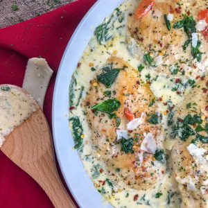 Creamy Garlic Parmesan and Roasted Red Pepper Chicken - a one-pan, easy-to-make comforting recipe that will give you all the warm fuzzy, content feelings. The chicken is pan-seared and combined in a delicious, creamy sauce combining all the perfect flavors of parmesan cheese, spinach, roasted red peppers, and garlic.