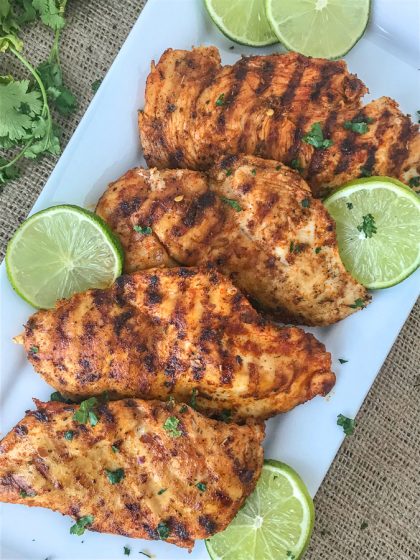 Grilled Cajun Lime Chicken - juicy, tender and flavorful chicken that is super easy to make and can be on your table in under 15 minutes! And can you really go wrong with a delicious slice of chicken that is under 200 calories?? #healthy #cajunseasoning #cajun #chickenbreast #grilledchicken #dinner | https://withpeanutbutterontop.com