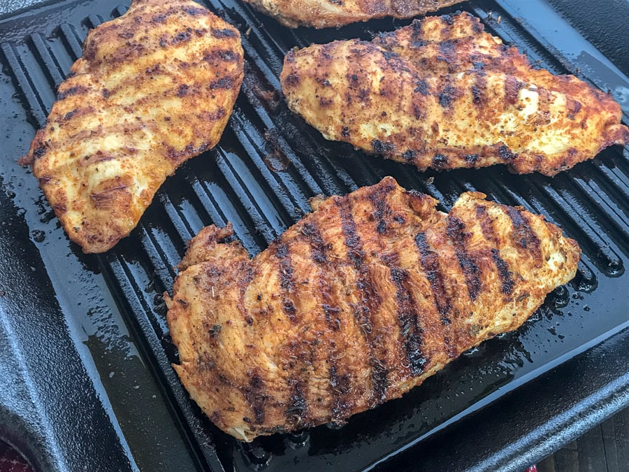 Grilled Cajun Lime Chicken - juicy, tender and flavorful chicken that is super easy to make and can be on your table in under 15 minutes!Â And can you really go wrong with a delicious slice of chicken that is under 200 calories?? #healthy #cajunseasoning #cajun #chickenbreast #grilledchicken #dinner | https://withpeanutbutterontop.com