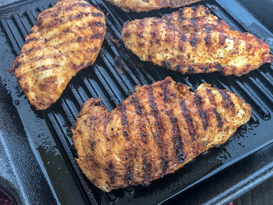Grilled Cajun Lime Chicken - juicy, tender and flavorful chicken that is super easy to make and can be on your table in under 15 minutes! And can you really go wrong with a delicious slice of chicken that is under 200 calories?? #healthy #cajunseasoning #cajun #chickenbreast #grilledchicken #dinner | https://withpeanutbutterontop.com
