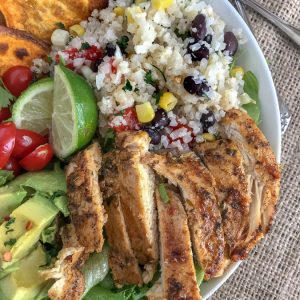 Jamaican Jerk Chicken Bowls - super simple and so much flavor packed into one bowl! These bowls have a hint of spice, but are packed full of healthy veggies and the perfect, healthy meal for any occasion! #healthy #chicken #bowls | https://withpeanutbutterontop.com