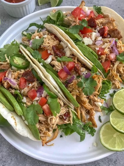 Easy Crockpot Chipotle Chicken Carnitas - a healthier take on the traditional pork carnitas that we all know and absolutely adore! Perfect for on-the-go individuals, for parties, and an easy option for your weekly meal prep! #carnitas #slowcooker #crockpot #mexican #cincodemayo https://withpeanutbutterontop.com
