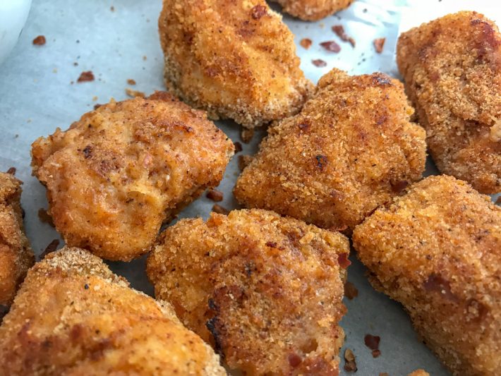 Baked Crispy Spicy Chicken Nuggets With Peanut Butter on Top