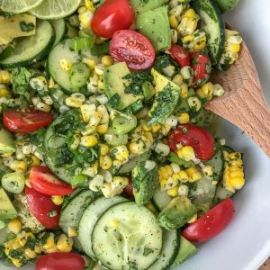 Cucumber Avocado Corn Salad - an easy to make, light and refreshing salad that is perfect as a side dish for any occasion! #salad #avocado #sidedishes #easy |https://withpeanutbutterontop.com