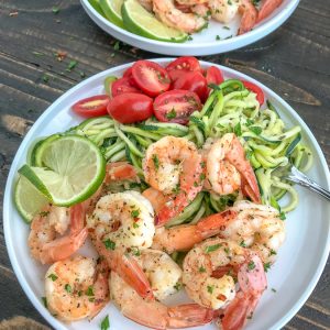 Garlic Honey Lime Shrimp and Zoodles -  the perfect low-carb, high-protein recipe that comes together in 15 minutes. Sweet, sticky, garlic lime cooked shrimp and zucchini noodles are the ultimate easy and healthy combination. #shrimp #zoodles #zucchininoodles #lowcarb #healthy | https://withpeanutbutterontop.com