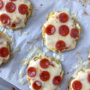 Mini Cauliflower Pepperoni Pizza's - the best, crispy cauliflower pizza you will ever try! Easy, healthier, and lower-carb! #cauliflowerpizza #cauliflower #lowcarb #healthy #pizza | https://withpeanutbutterontop.com