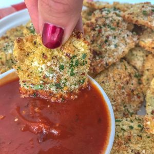 Baked Parmesan Crusted Ravioli Bites - the perfect game-day gathering or party finger food that you can enjoy without the guilt of traditional fried ravioli! Super crispy on the outside, yet cheesy on the inside. Easy to make! #ravioli #appetizers #baked #gameday | https://withpeanutbutterontop.com