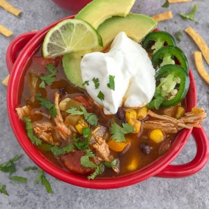 Easy Instant Pot Chicken Taco Soup - a delicious, healthy, and super easy meal to make that requires little effort and only one pot! Perfect for #mealprep and cold winter days! #tacosoup #instantpot #instantpotrecipes #tacotuesday #soup | https://withpeanutbutterontop.com