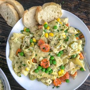 Easy One Pot Creamy Chicken and Noodles - the perfect classic comfort dish that contains delicious, creamy pasta, and is packed not just full of flavor, but vegetables as well! Guaranteed to be a family favorite! #easydinners #onepot #onepotmeals #easy #creamychickenandnoodles | https://withpeanutbutterontop.com