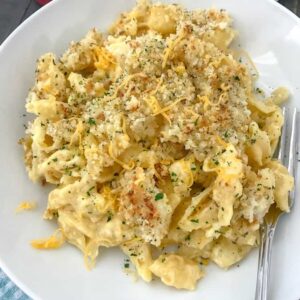 Baked Macaroni and Cheese - cheesy, creamy perfection! The ultimate macaroni and cheese dish that will make your taste buds sigh like a comfort dish should! #baked #macaroniandcheese #macandcheese #maindish |https://withpeanutbutterontop.com