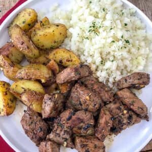 Garlic Butter Steak and Potatoes - an easy one-pan recipe that is bursting full of flavor! Crispy on the outside, fork-tender on the inside, potatoes and the most juicy steak. Both are cooked to perfection in a garlic and herb-butter sauce. Ready in 30 minutes or less! | https://withpeanutbutterontop.com