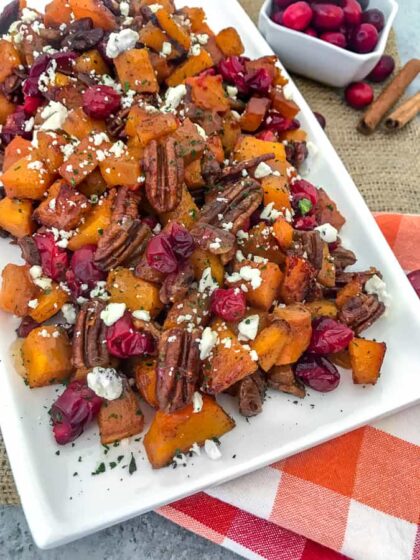 Honey Roasted Butternut Squash - a side dish that comes together so easily and with an abundance of flavor! Your taste buds will be tickled pink with this dish! Easy to make and perfect for the holiday season. #butternutsquash #thanksgiving #sidedish | https://withpeanutbutterontop.com