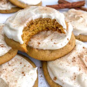 Pumpkin Cake Cookies with Homemade Cream Cheese Frosting - soft, fluffy, and tastes like mix between a cookie and cake! So delicious you will have a hard time just having one! #cookies #pumpkin #pumpkincookies #dessert | https://withpeanutbutterontop.com
