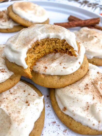 Pumpkin Cake Cookies with Homemade Cream Cheese Frosting - soft, fluffy, and tastes like mix between a cookie and cake! So delicious you will have a hard time just having one! #cookies #pumpkin #pumpkincookies #dessert | https://withpeanutbutterontop.com