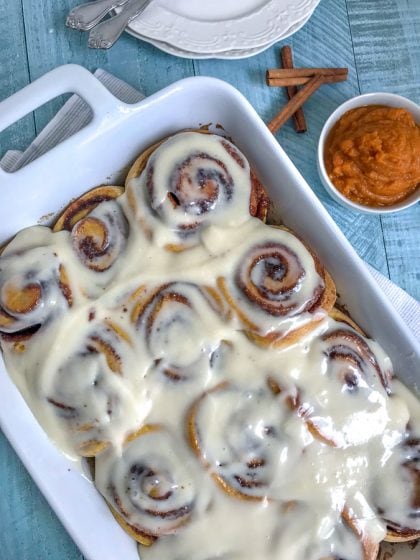 Pumpkin Cinnamon Rolls with Cream Cheese Frosting - a perfect, fall twist to a classic breakfast favorite! Fill your home and your tummies with this amazing, flavor-packed dessert! #pumpkin #cinnamonrolls #pumpkincinnamonrolls #breakfast #fall | https://withpeanutbutterontop.com