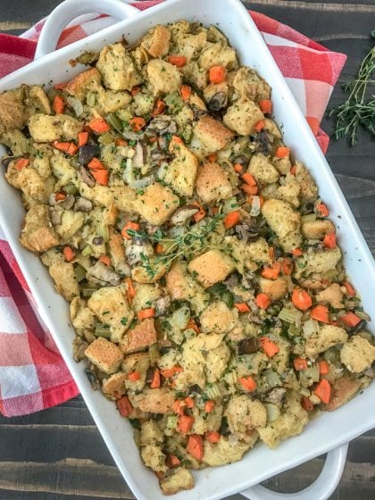 Simple and Healthy Thanksgiving Stuffing - traditional herb stuffing lightened up a bit and packed full of flavorful herbs and vegetables! Sure to be a hit on any Thanksgiving or Friendsgiving table! #stuffing #thanksgivingstuffing #thanksgiving #friendsgiving | https://withpeanutbutterontop.com