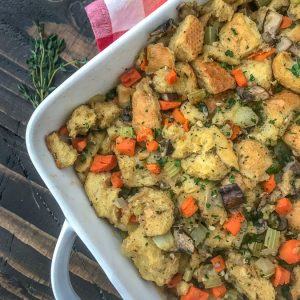 Simple and Healthy Thanksgiving Stuffing - traditional herb stuffing lightened up a bit and packed full of flavorful herbs and vegetables! Sure to be a hit on any Thanksgiving or Friendsgiving table! #stuffing #thanksgivingstuffing #thanksgiving #friendsgiving | https://withpeanutbutterontop.com