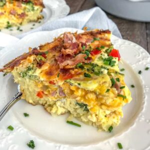 Ham and Broccoli Hash Brown Quiche - the perfect use for leftover holiday ham! Easy to make, full of vegetables and flavor, and guaranteed to wow your family and guests! Hash browns replace the traditional crust in a delicious way. #breakfast #ham #leftovers #quiche | https://withpeanutbutterontop.com