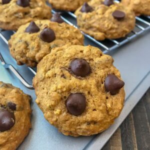 Chocolate Chip Pumpkin Pecan Cookies - soft, moist cookies with the perfect hint of pumpkin flavor, while being loaded with oats, chocolate chips, and pecans! Great for after school or on-the-go snacks! #cookies #pumpkincookies #pumpkin #chocolatechip | https://withpeanutbutterontop.com