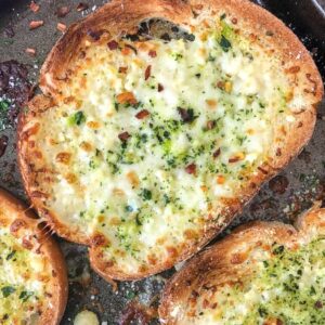 Easy and Quick Garlic Cheese Bread - super simple recipe that comes together in minutes with only a handful of ingredients guaranteed to already be in your kitchen! Cheesy, garlic bread perfection! #garliccheesebread #garlicbread #sidedish #pasta #spaghetti | https://withpeanutbutterontop.com