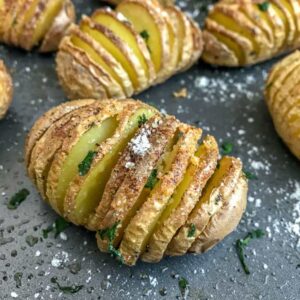 Mini Garlic Butter Parmesan Hasselback Potatoes - super easy side dish to make that is perfect for any occasion! Crispy on the outside, flaky on the inside, and incredibly delicious! #hasselback #potatoes #sidedish | https://withpeanutbutterontop.com