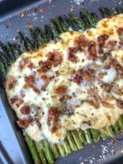 Garlic Roasted Asparagus and Bacon Gratin - the ultimate au gratin vegetable dish you will ever try! Oven-roasted asparagus topped with garlic, shallots, and the creamiest three-cheese sauce! Perfect side dish to any meal and for any occasion! #asparagus #augratin #sidedish | https://withpeanutbutteronto.com