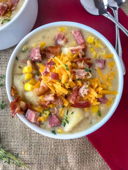 Instant Pot Ham Potato and Corn Chowder - an easy-to-make, one pot soup that uses leftover ham bone and ham from the holidays! Full of sweet corn, potatoes, and salty chunks of ham. Sure to be a crowd pleaser at your dinner table! #soup #hambone #ham #chowder #onepot | https://withpeanutbutterontop.com