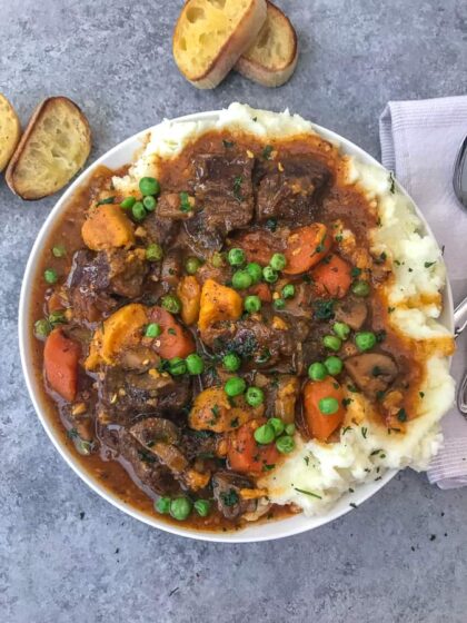 Instant Pot Sweet Potato Beef Stew - Learn how to make the BEST beef stew in the Instant Pot in approximately 1 hour! Full of flavor, vegetables, sweet potatoes and the most tender beef! #beefstew #instantpot #instantpotbeefstew | https://withpeanutbutterontop.com