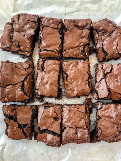 Triple Chocolate Walnut Fudge Brownies | soft, chewy, gooey centers with a crispy, crackle topping! The best brownies you will ever try! Filled with chocolate and finely chopped walnuts. Sure to become a repeat dessert in your home. #brownies #chocolate #triplechocolate | https://withpeanutbutterontop.com