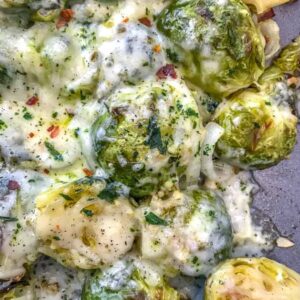 Cheesy Pepper Jack Roasted Brussels Sprouts with freshly grated pepper jack cheese make for the best side dish! They are very easy to make and come together on on sheet pan! Tender, crisp brussels sprouts are roasted with garlic, pepper jack cheese, and onions. #sheetpan #sheetpanrecipes #brusselssprouts #cheesybrusselssprouts | https://withpeanutbutterontop.com