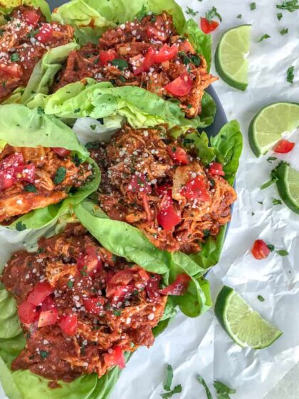 Chicken Tinga made with shredded chicken, tomato sauce, fire roasted tomatoes, and chipotle chilis in adobo. Comes together in 20 minutes, is full of bold flavor, and is great in lettuce wraps and as a #MealPrep lunch! #chickentinga #chicken #easyrecipes #healthy #lunch #dinner | https://withpeanutbutterontop.com