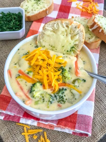 Make Panera's Broccoli Cheese Soup at home easily! This Broccoli Cheddar Soup comes together in one pan and is loaded with broccoli, carrots and cheddar cheese. Creamy, savory perfection! #soup #panerabroccolicheese #broccolicheddar | https://withpeanutbutterontop.com