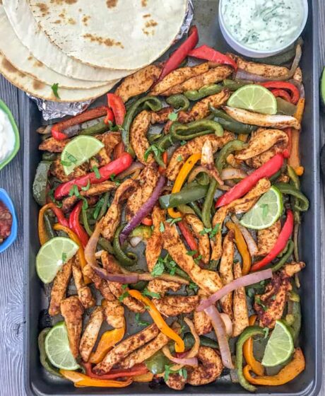 Easy Sheet Pan Chicken Fajitas - an easy, flavorful, one-pan meal that comes together effortlessly and with minimal cleanup. Great for lunches, meal prep, or if you're looking for a quick and simple dinner option tonight! #mealprep #sheetpanrecipes #sheetpan #chickenfajitas | https://withpeanutbutterontop.com