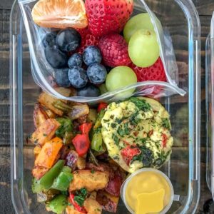 Egg Muffin Breakfast Meal Prep - stay in bed and catch your Zzzz's and have a healthy and filling breakfast ready to go all week with this meal prep option! Egg Muffins - done three ways, Sheet Pan Breakfast Potatoes, and a delicious side of fruit for that early morning sweet tooth! #mealprep #breakfastmealprep #breakfast #eggmuffins | https://withpeanutbutterontop.com