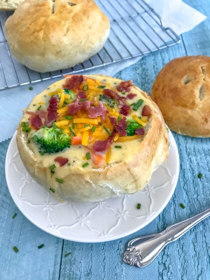 Learn how to make Bread Bowls at home with this simple recipe, containing only 6 ingredients! Golden and crispy on the outside while being soft and fluffy on the inside! Perfect for soups, stews, and dips! #homemadebread #breadbowls #soupbowls #soup | https://withpeanutbutterontop.com