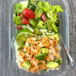 Instant Pot Buffalo Chicken Meal Prep - add this super simple and fast 10-minute buffalo chicken recipe to your weekly meal prep! Low-carb, packed with veggies, and absolutely delicious! #mealprep #lowcarb #lowcarbmealprep #instantpot #buffalochicken | https://withpeanutbutterontop.com