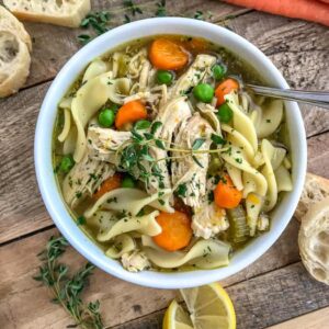 Instant Pot Chicken Noodle Soup - oh so comforting soup that is very easy to make, comes together in the Instant Pot and has a ton of flavor! This is the perfect healthy meal for a cold winter day. Loaded with tender chicken, vegetables, and noodles!