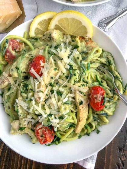 Creamy Chicken and Avocado Pesto Zoodles - a super creamy, easy, and healthy meal option that comes together in 30 minutes! Low-carb, low-calorie, high in healthy fats - this recipe is the ultimate comfort dish without the guilt. #lowcarb #zucchininoodles #zoodles #avocado | https://withpeanutbutterontop.com