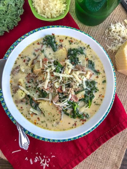 Make one of Olive Garden's most popular soups, but at home and on a healthier, lighter note! This soup is rich, creamy and full of flavor. You won't be able to tell that it's not from Olive Garden! Filled with tender potatoes, bacon, turkey sausage and kale, this soup is perfect for these cold wintery days! #olivegarden #zuppatoscana #soup #onepot | https://withpeanutbutterontop.com