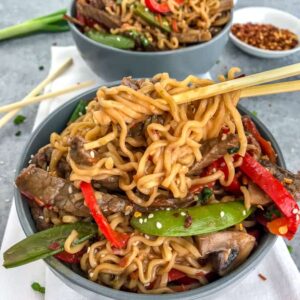 This Garlic Beef and Ramen Stir Fry is so easy to make, bursting full of flavor, and guaranteed to wow you and your dinner guests! A much healthier version of take-out that can be made right at home! #takeout #ramennoodles #garlicbeefandramen | https://withpeanutbutterontop.com