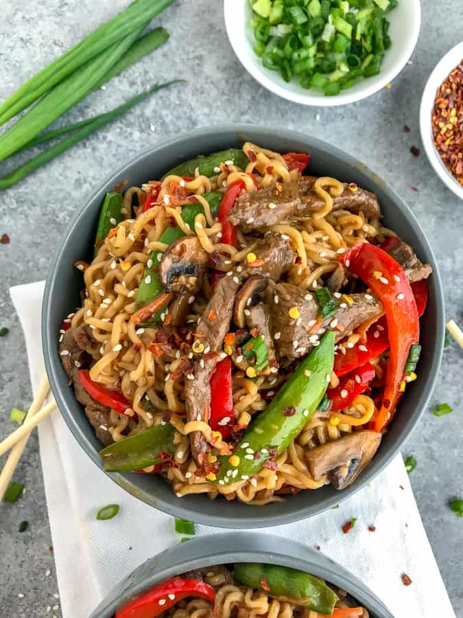 This Garlic Beef and Ramen Stir Fry is so easy to make, bursting full of flavor, and guaranteed to wow you and your dinner guests! A much healthier version of take-out that can be made right at home! #takeout #ramennoodles #garlicbeefandramen | https://withpeanutbutterontop.com