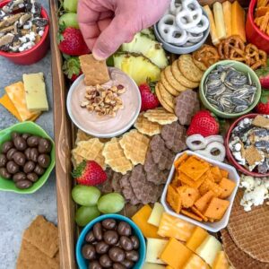 Party Grazing Snack Tray - the ultimate snack tray for any party! No cooking required, easy to throw together and full of sweet and salty snacks. Guaranteed to wow your family and friends! #partyplatter #party #partytray #partyboard #snacks #appetizers | https://withpeanutbutterontop.com