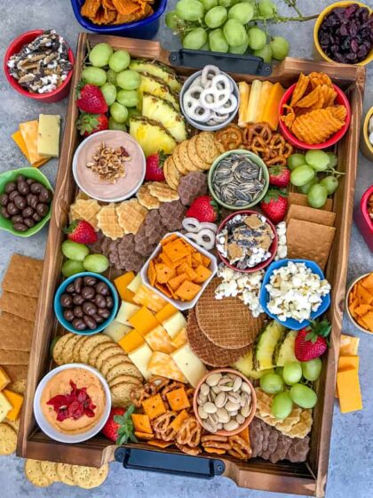 Party Grazing Snack Tray - the ultimate snack tray for any party! No cooking required, easy to throw together and full of sweet and salty snacks. Guaranteed to wow your family and friends! #partyplatter #party #partytray #partyboard #snacks #appetizers | https://withpeanutbutterontop.com